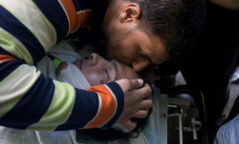 Basem Ibrahim Abu Rahme in a Ramallah hospital after he was killed on 17 April 2009. (activestills.org)