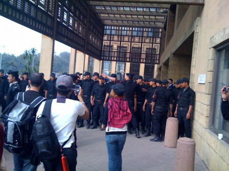 Marchers Marchers facing hundreds of police at the UN building in Cairo, photo by Ali Abunimah